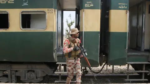 Reuters A Pakistan Army soldier stands guard next to a rescue train Reuters A Pakistan Army soldier stands guard next to a rescue train