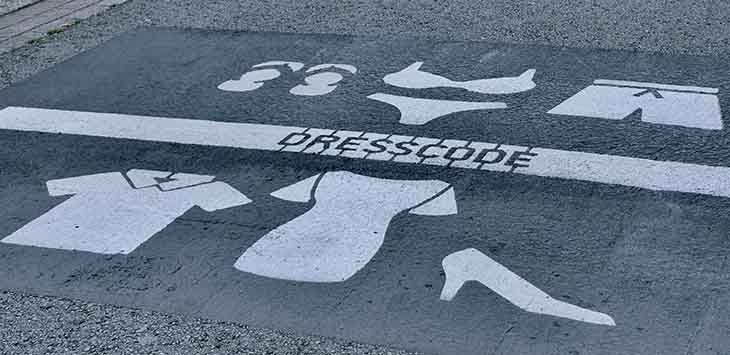Photo of street markings indicating a public dress code.