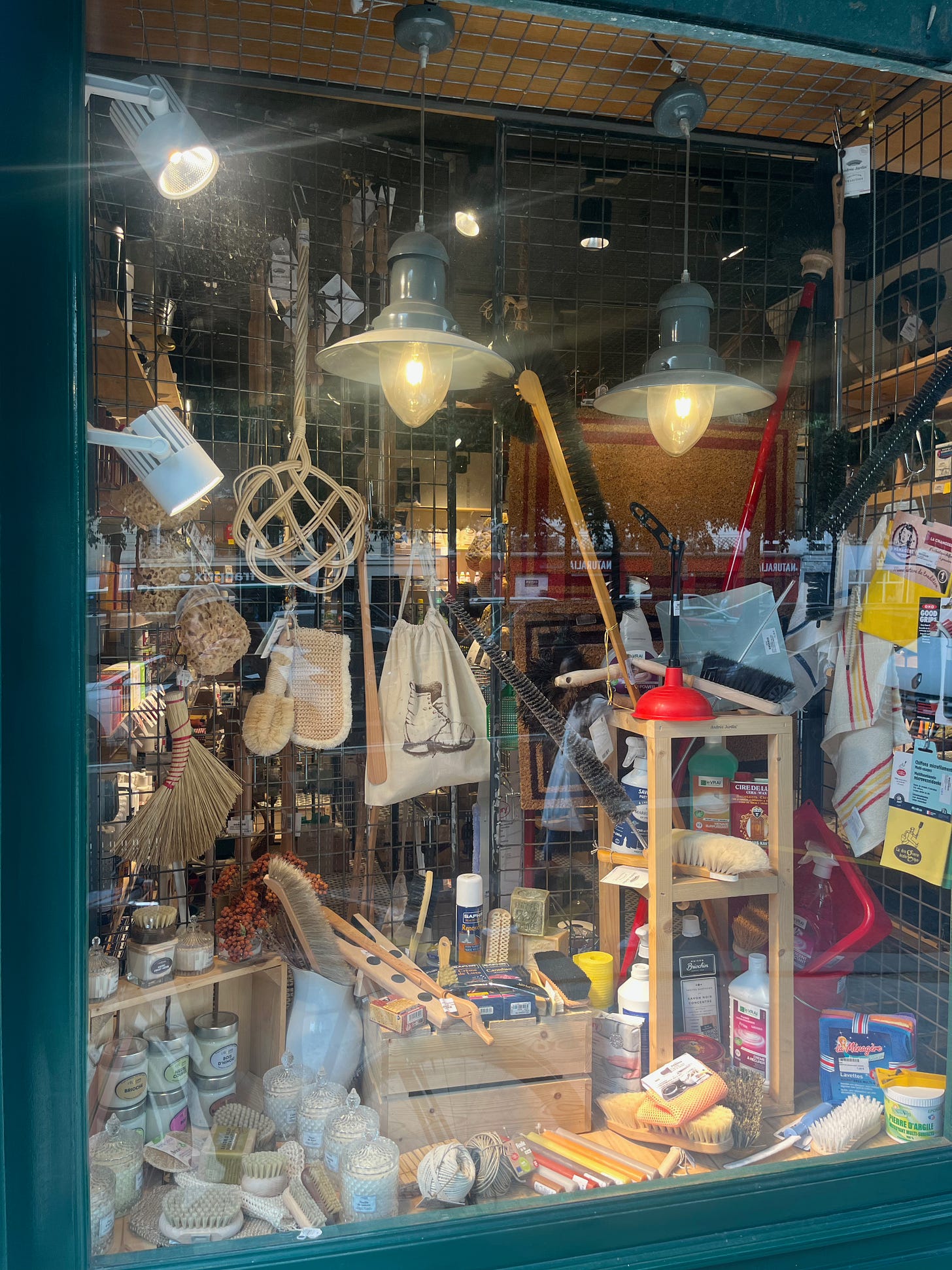 a closer look through the store window, containing a serious plethora of brushes and cleaning supplies. Jackpot.