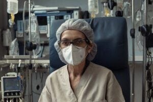 elderly woman in mask in a hospital