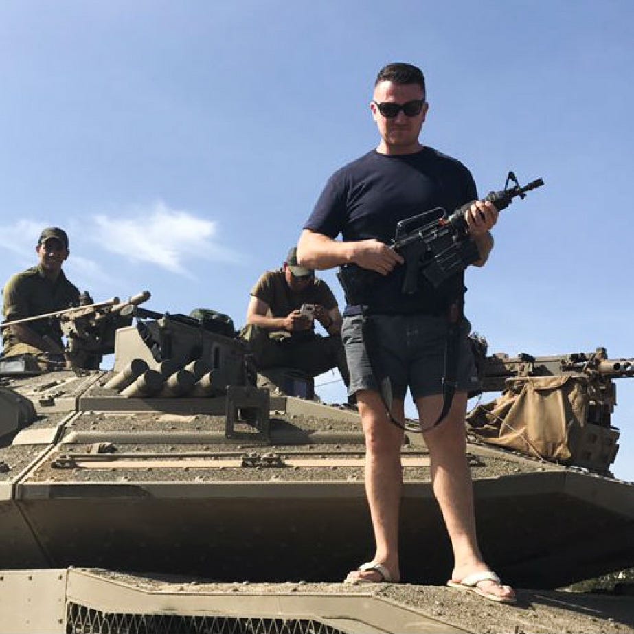 Tommy Robinson poses with IDF troops during a visit to Israel. Photo | Twitter