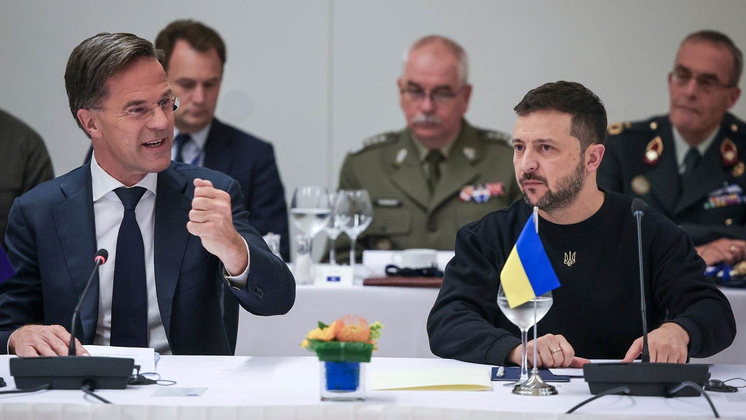 NATO Secretary General Mark Rutte, left, speaks with Ukraine's President Volodymyr Zelenskyy during the NATO-Ukraine Council working dinner at NATO Headquarters in Brussels, Thursday, Oct. 17, 2024. (Olivier Matthys, Pool Photo via AP)