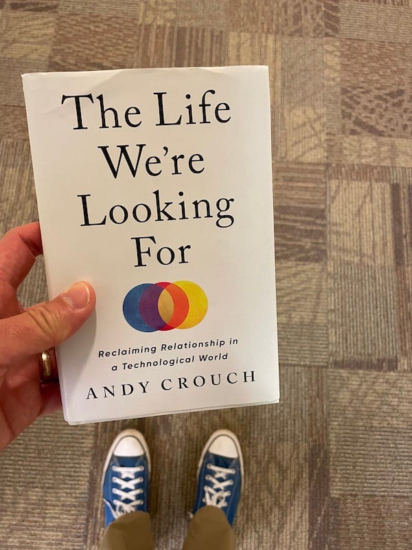 The cover of The Life We're Looking For by Andy Crouch (with Dr. Dave's blue Chuck Taylors in the background)