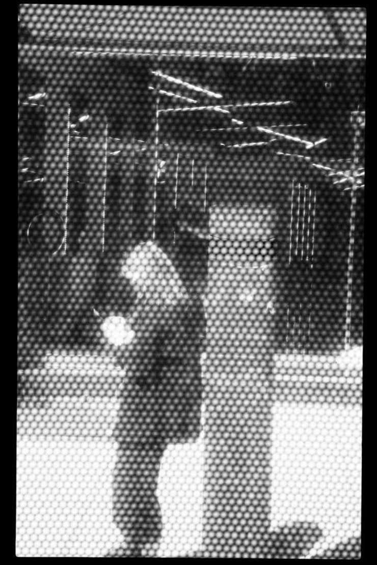 Drive-by in Midtown, New York City, 27 March 2021. This photo was shot from a moving bus and through a part of the window with all these dots on it.