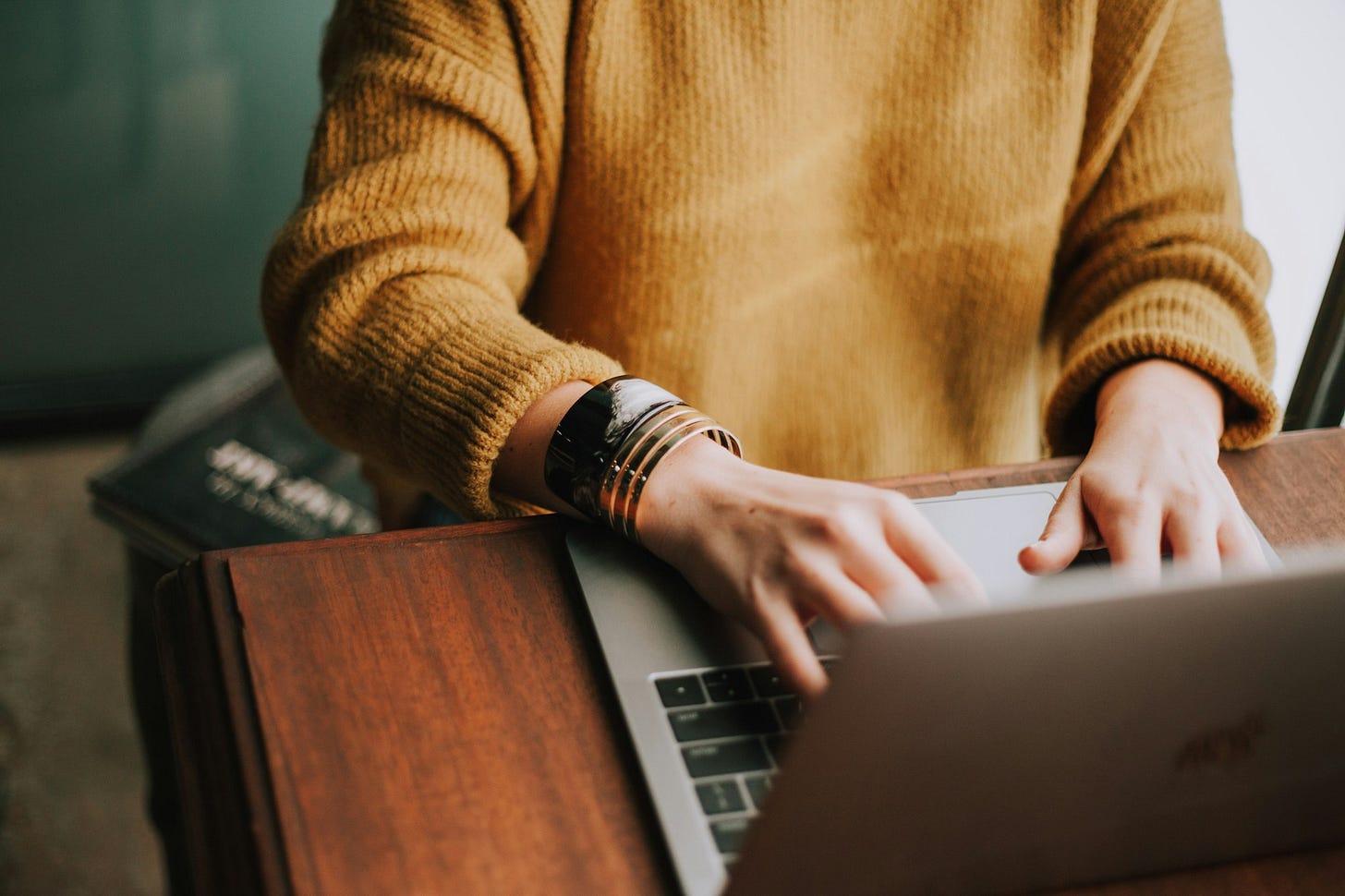 A person typing on a computer A person typing on a computer