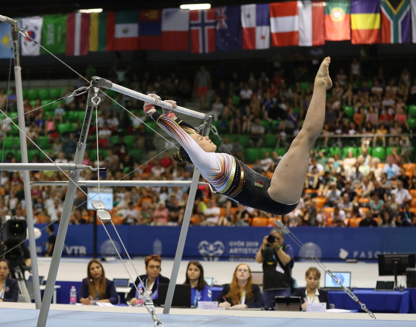 swinging on uneven bars