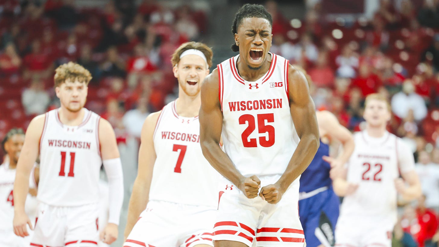 Badgers guard John Blackwell celebrates in the home opener against Holy Cross