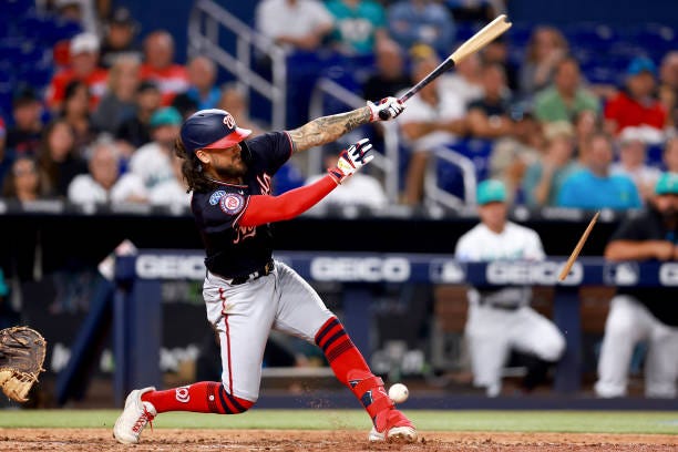 Michael Chavis of the Washington Nationals breaks his bat against the Miami Marlins during the eighth inning at loanDepot park on August 25, 2023 in...