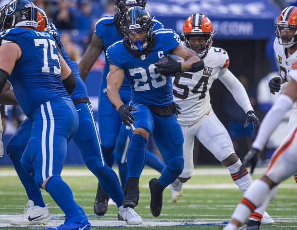 Jonathan Taylor of the Indianapolis Colts runs the ball during the game against the Cleveland Browns at Lucas Oil Stadium on October 22, 2023 in...