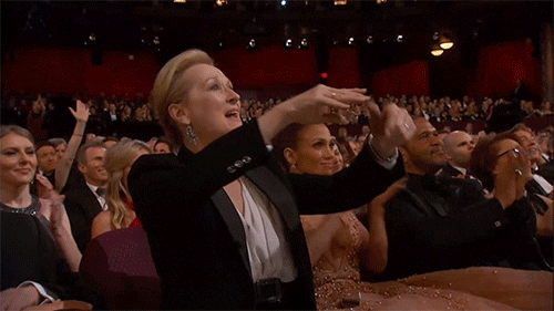 A gif of Meryl Streep clapping and pointing in the audience of the Academy Awards