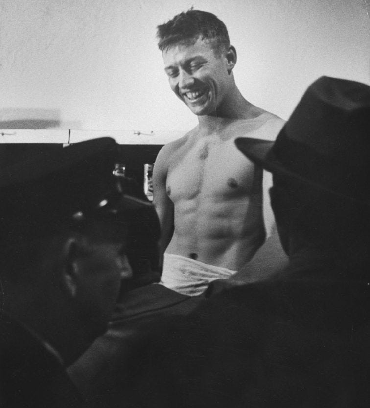 Mickey Mantle shirtless smiles in locker room after winning World Series October 1952