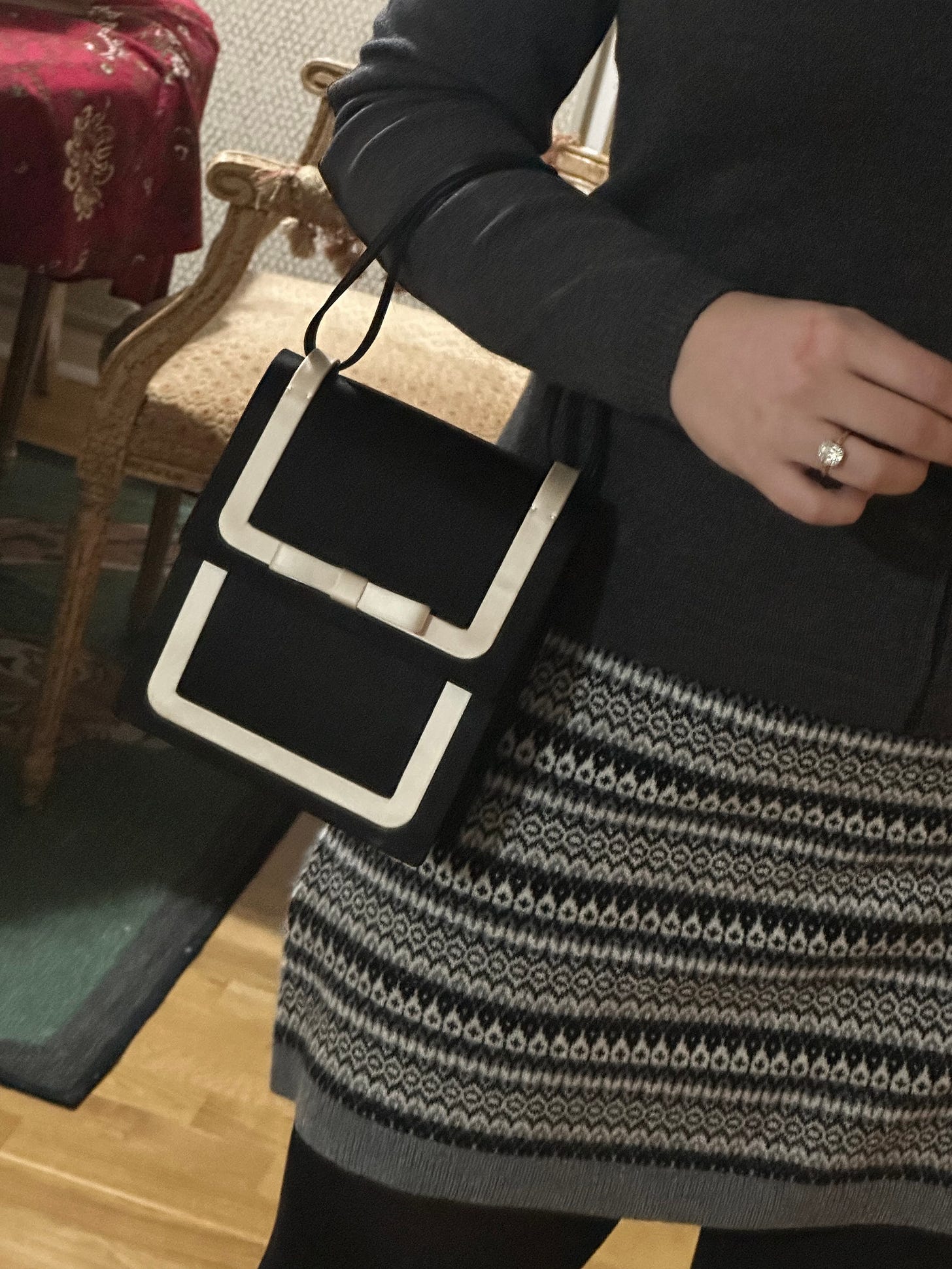 Image of Bella wearing a bag from J Crew.