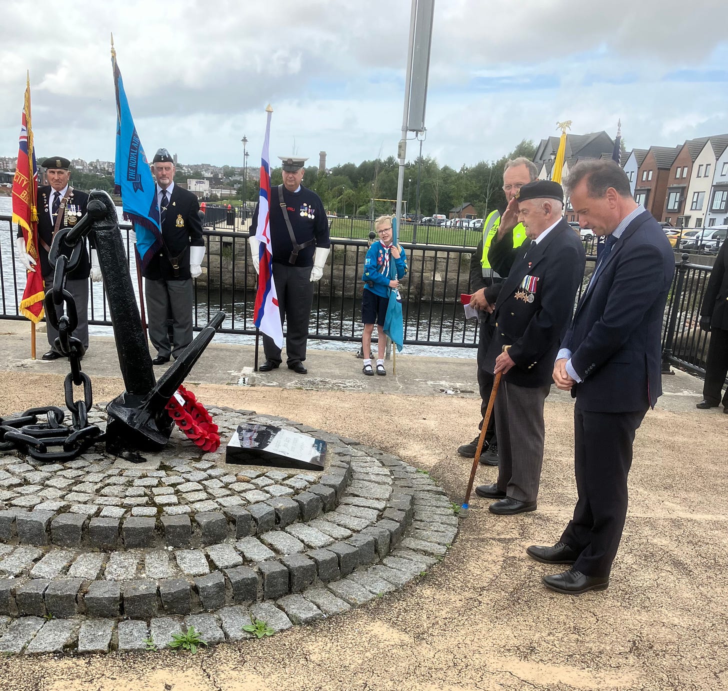 JOE NORTON, HAVING LAID THE WREATH ACCOMPANIED BY ALUN CAIRNS M.P.