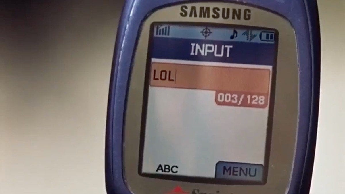 Still from A Cinderella Story that shows Sam's flip phone with "LOL" typed into a text message box