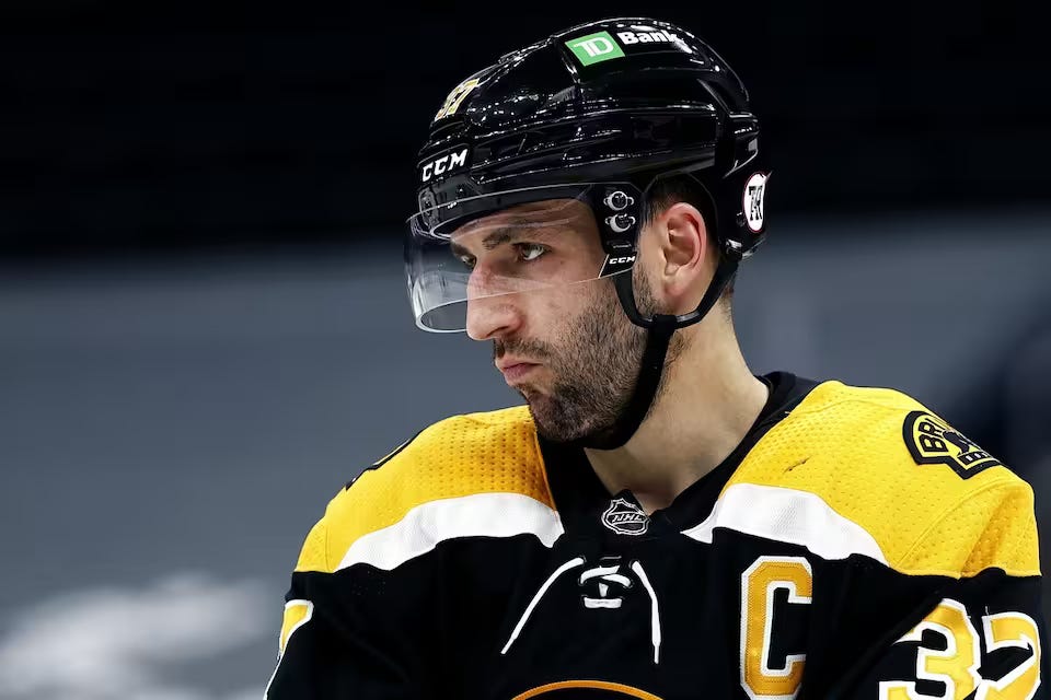 Patrice Bergeron of the Bruins looking off into the distance during a game.