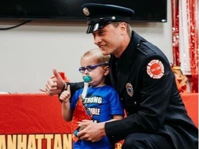 Brendan Burns, 4, of Manhattan, at a ceremony swearing him in as an honorary Manhattan firefighter.