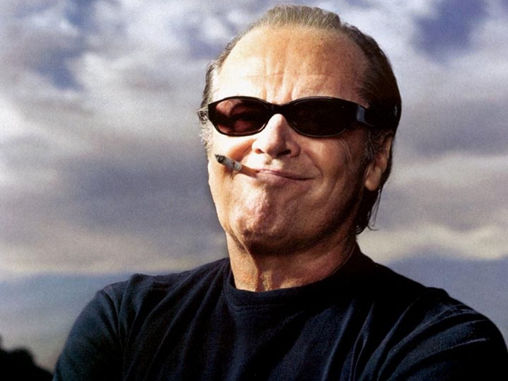 A promotional photo of Jack Nicholson smoking and smirking