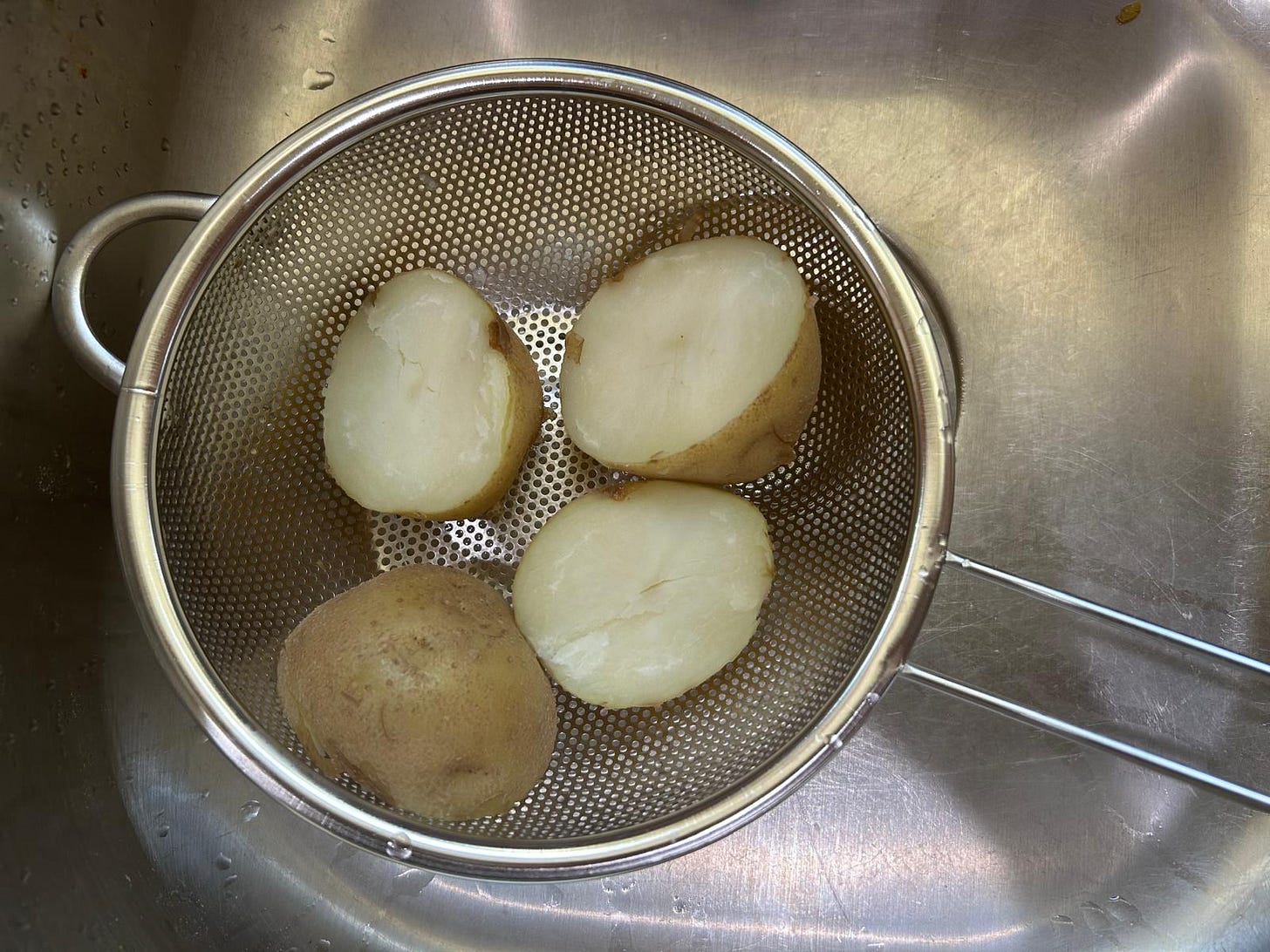 Boiled potatoes waiting to be peeled