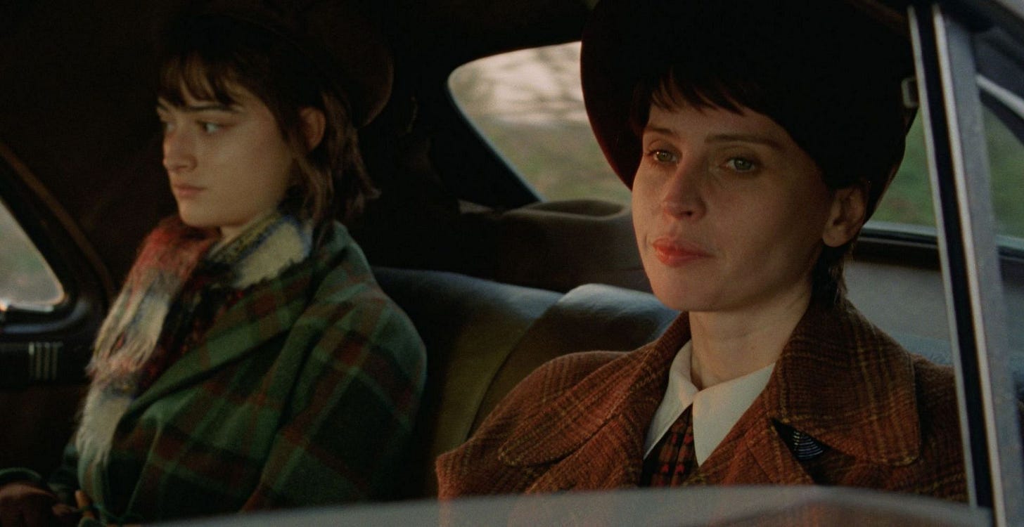 A shot from The Brutalist of Zsófia (left) and Erzsébet sitting next to one another in a car.