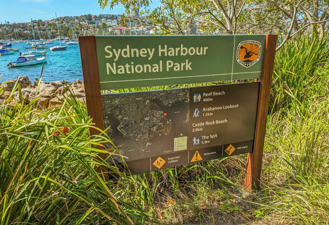 A picture of a sign reading Sydney Harbour National Park.