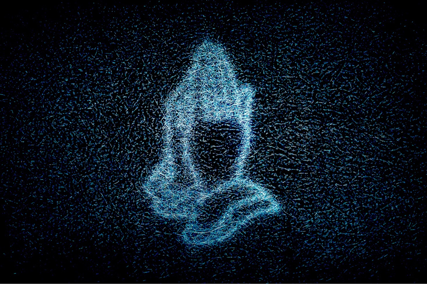 A blue neon sign of a pair of praying hands, on a black background, seen through a frosted window.