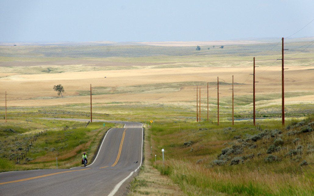 Chelsea climbs a long hill in the plains somewhere near the Lewis and Clark trail.