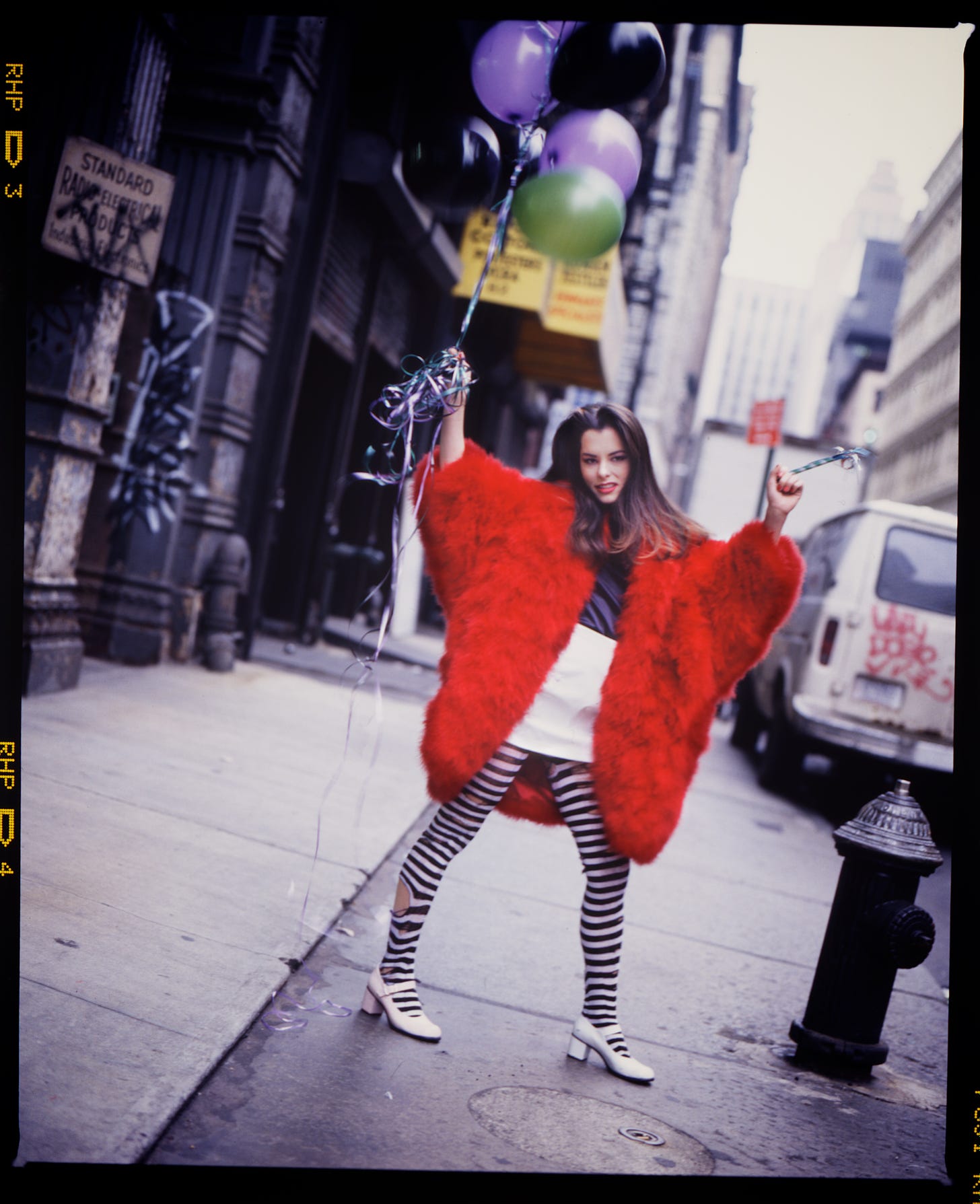 Parker Posey on Franklin Street NYC with baloons