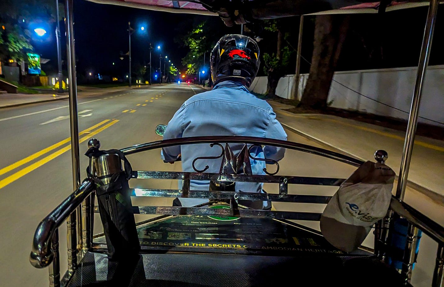 A view or Mr. Chhun from the backseat of our tuk tuk.