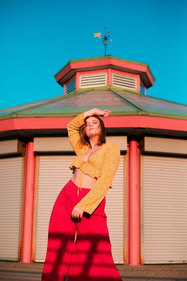 Woman posing in front of a monument structure.