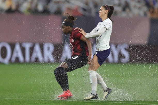 Kadeisha Buchanan of Canada and Alex Morgan of United States fight for position during Semifinals - 2024 Concacaf W Gold Cup match between Canada and...