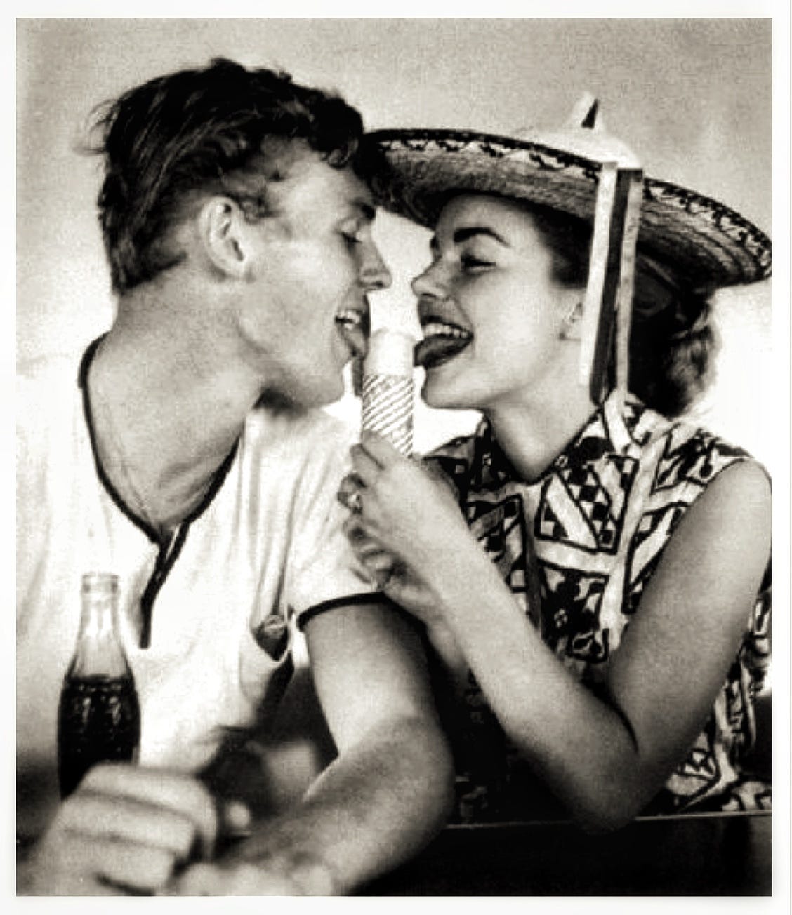 Tab Hunter and Terry Moore compare ice cream cone licking techniques. 