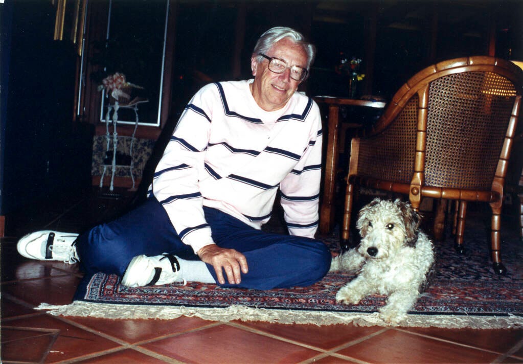 The late Charles Schulz with his rescue dog, Andy. © Jean Schulz, Courtesy of Charles M. Schulz Museum and Research Center.