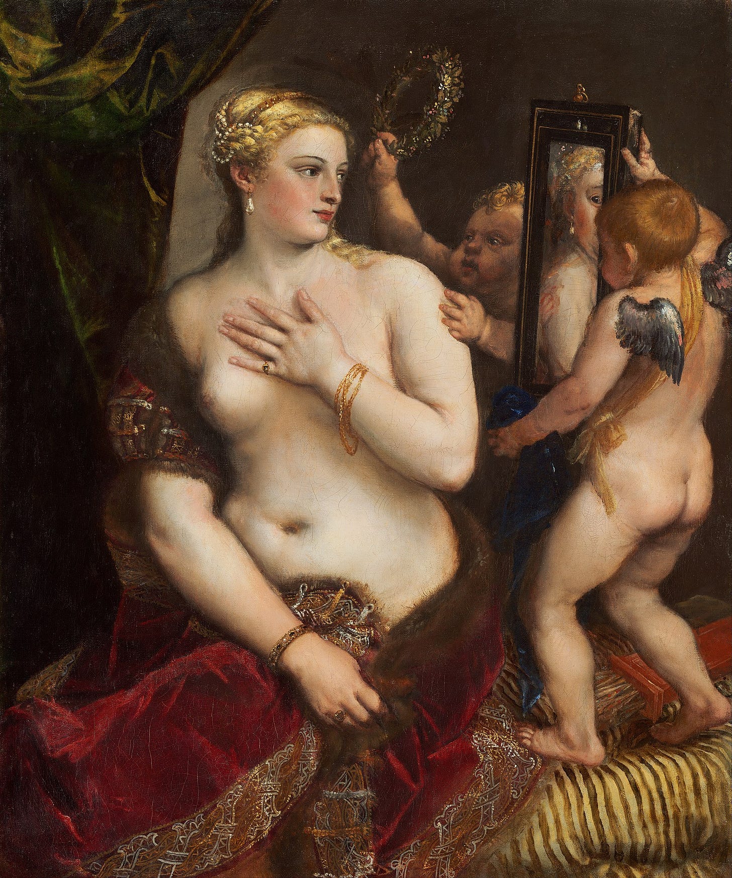 Painting of the goddess Venus, golden-haired, topless, with her lower half covered by a fur-trimmed red cloak. She admires herself in a mirror, held by Cupid. Another infantile figure is about to place a wreath on her head.