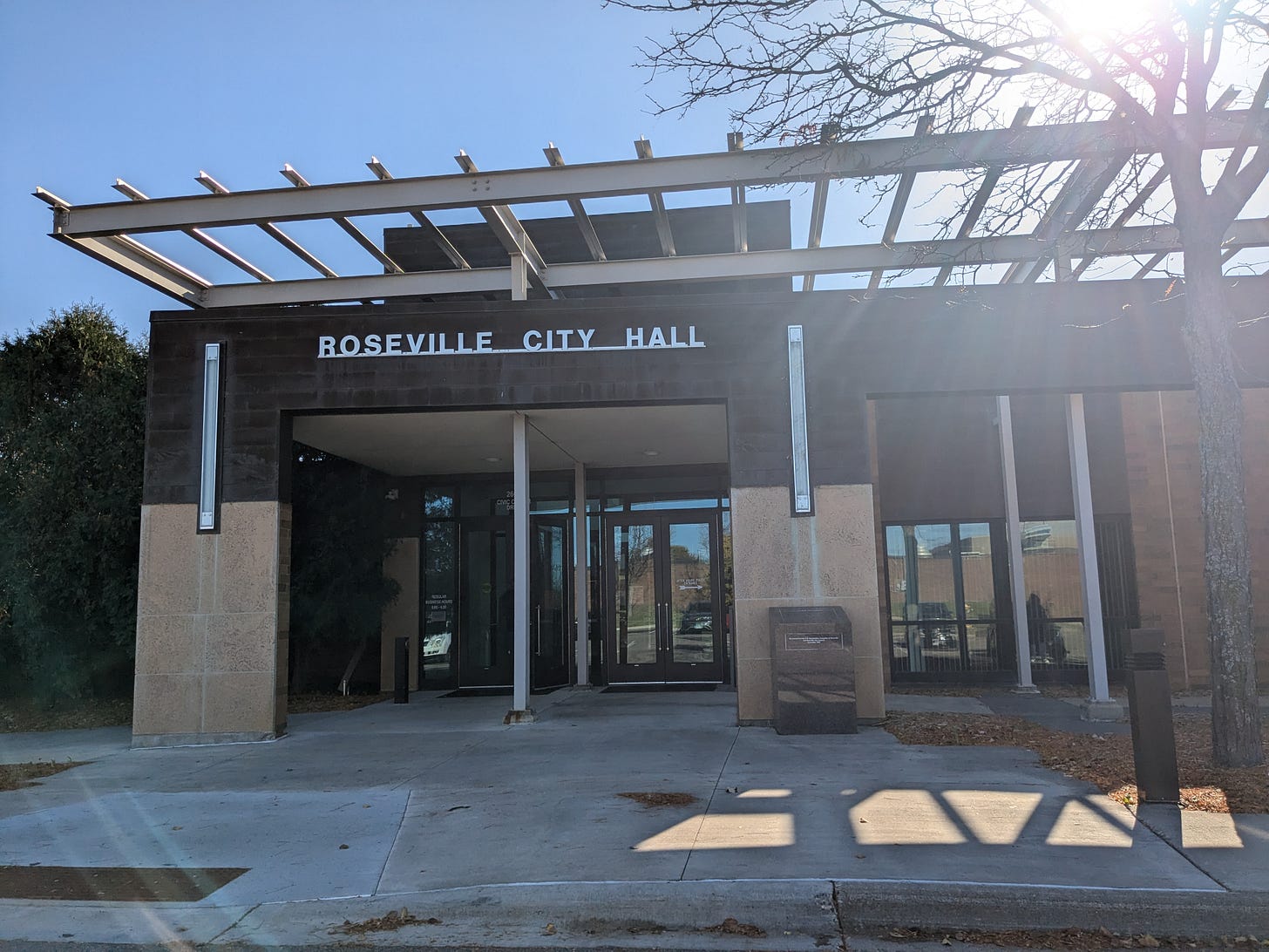 Photo of the front entrance of Roseville City Hall .