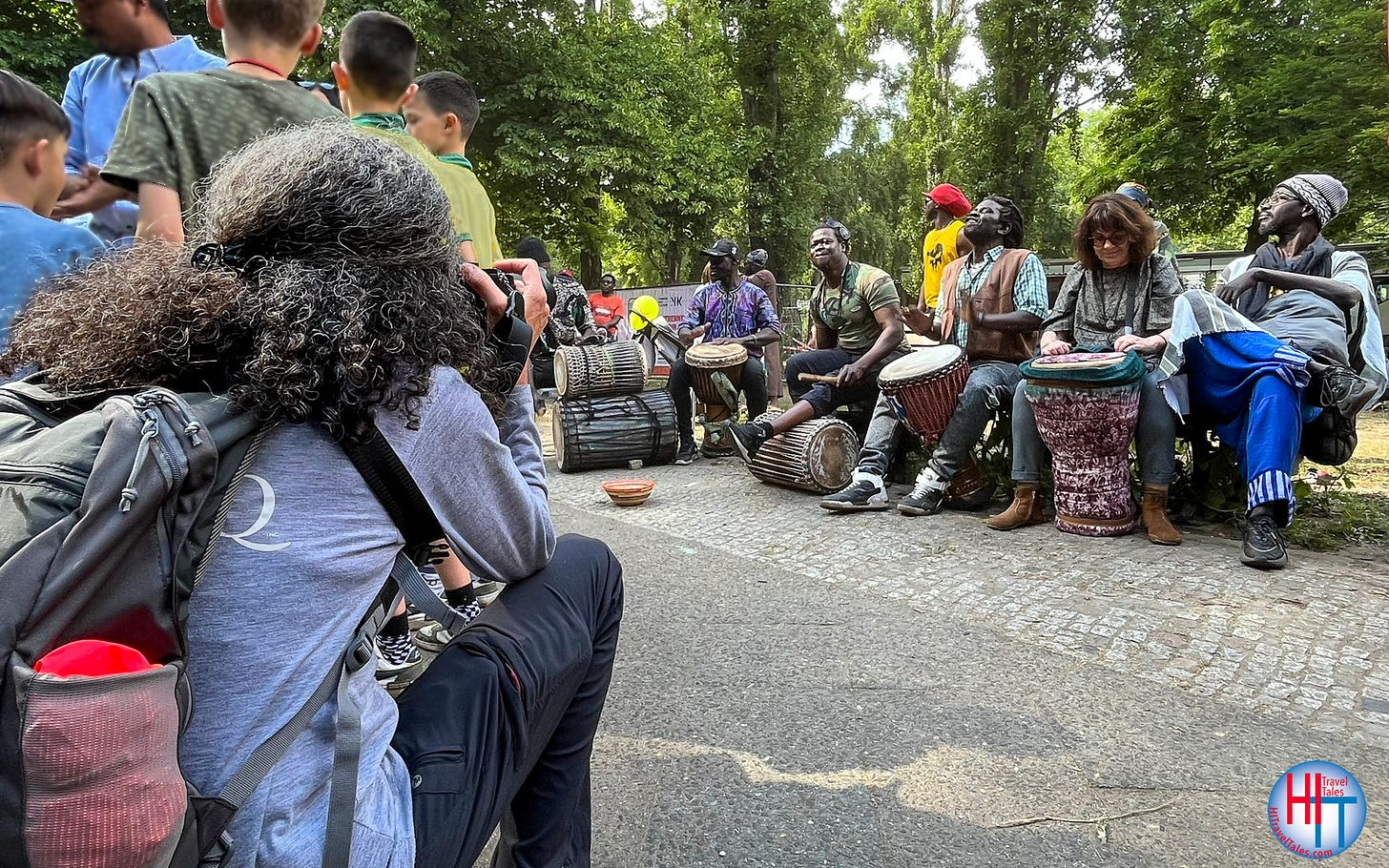 Therese Iknoian, the photographer and author, taking a photo of Jamaican drummers in Berlin.