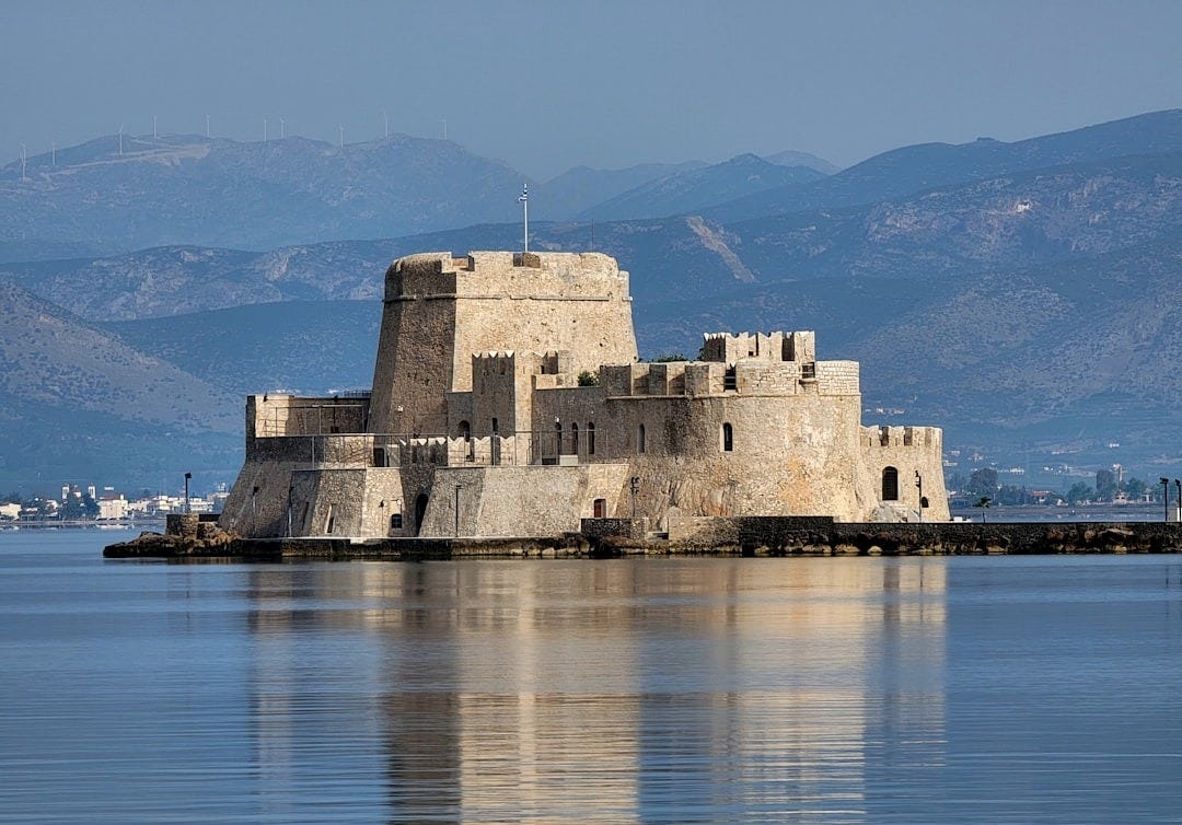 a castle sitting on top of a body of water