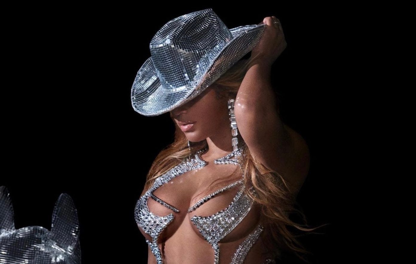 Beyoncé wearing rhinestone-studded cowgirl attire that seems elegant yet impractical.