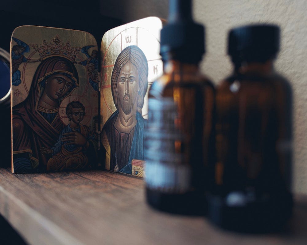 brown and black bottle on brown wooden table