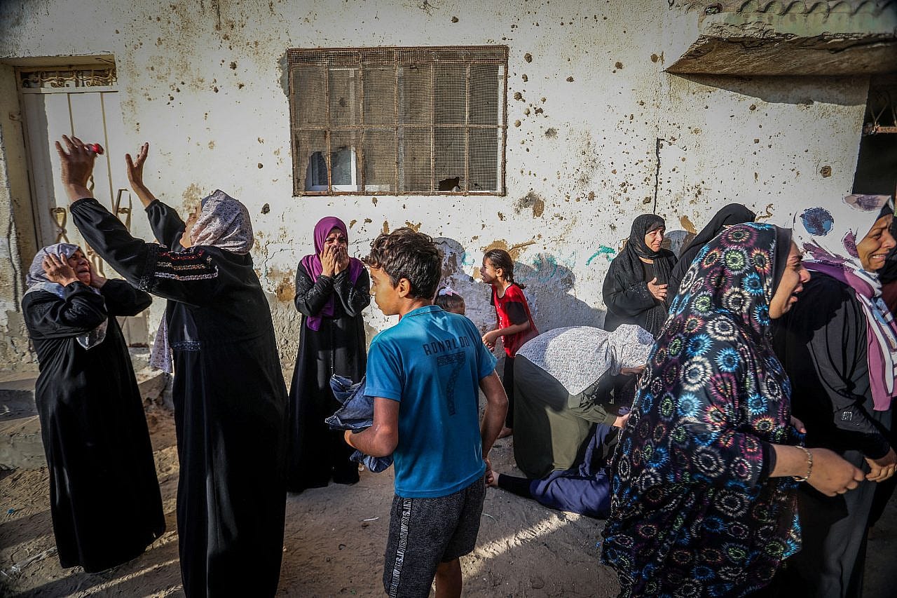 Palestinians react to the devastation caused by an Israeli airstrike in Rafah, southern Gaza Strip, November 11, 2023. (Abed Rahim Khatib/Flash90)