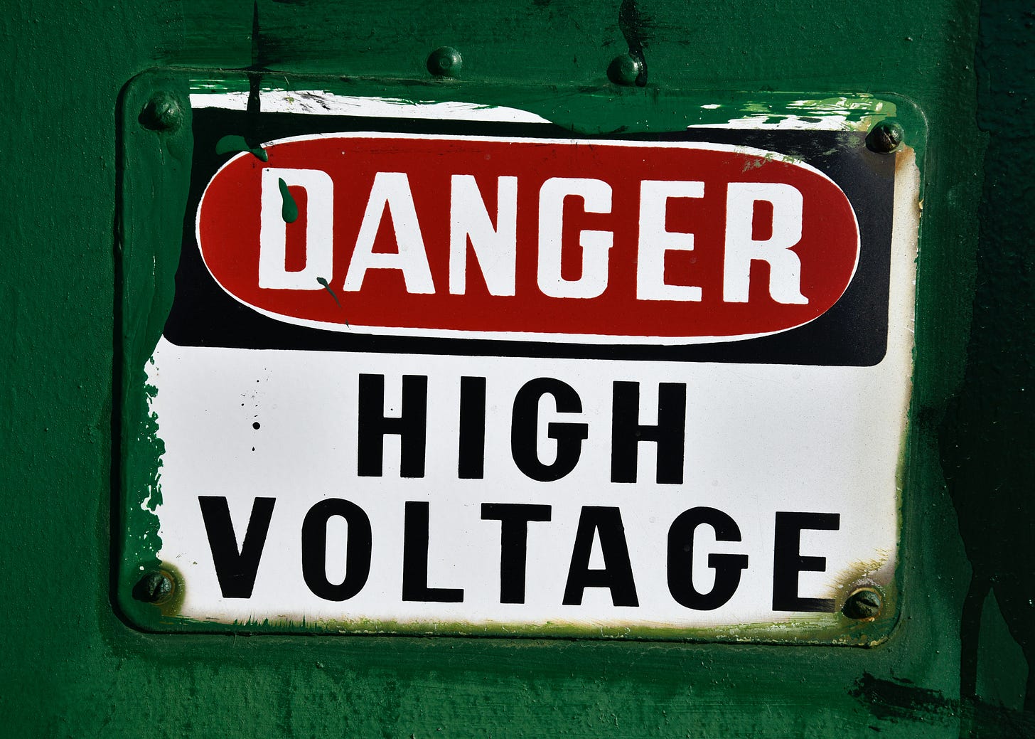 Picture of a metal sign that reads Danger, High Voltage.