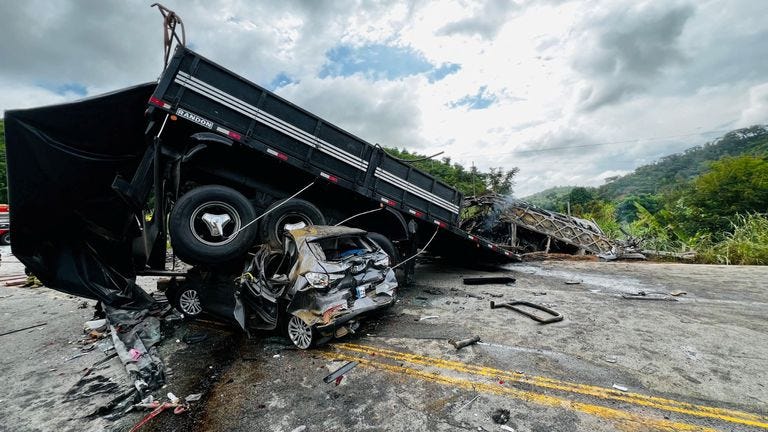 Emergency crews responding to a highway crash site in Minas Gerais, Brazil, involving a passenger bus and a truck.