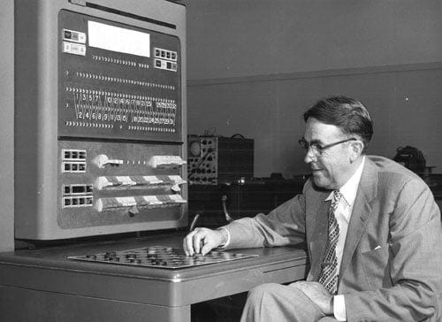 Arthur Samuel plays checkers with an IBM 704 computer