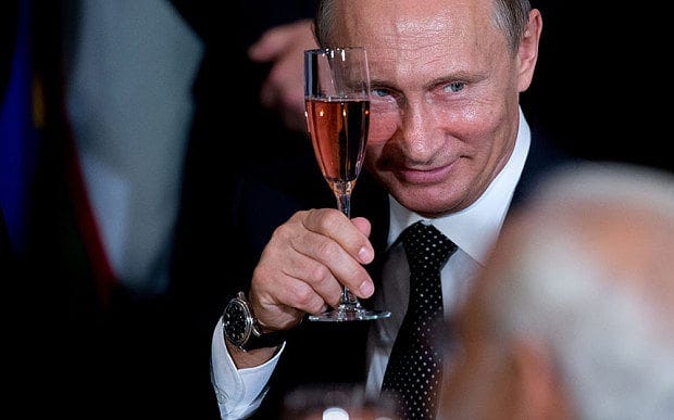 President Putin holds up a glass during a toast at a luncheon hosted by United Nations Secretary-General Ban Ki-moon