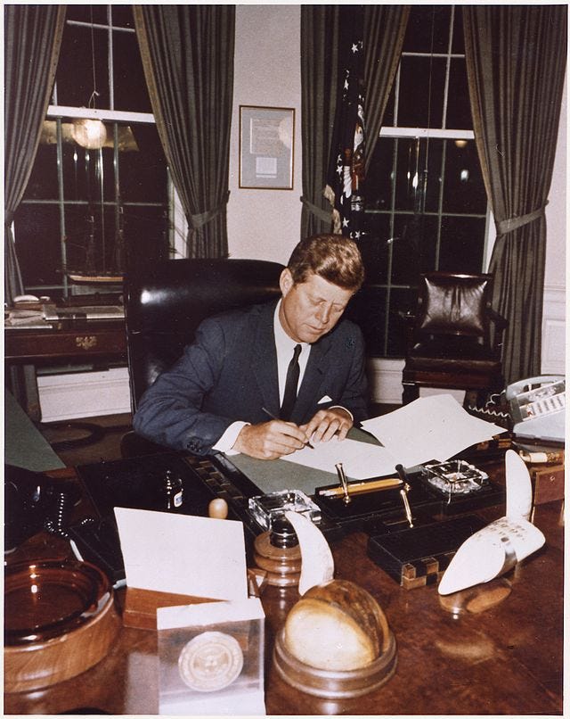 President confers with Secretary of Defense. President Kennedy, Secretary of Defense Robert S. McNamara. White House, West Wing Collonade.