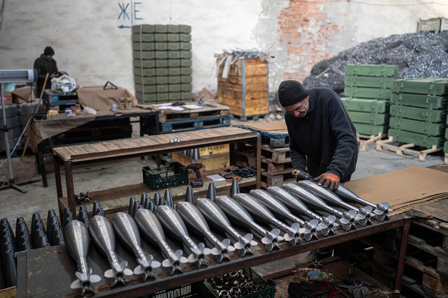 A worker assembles mortar shells at a factory in Ukraine.