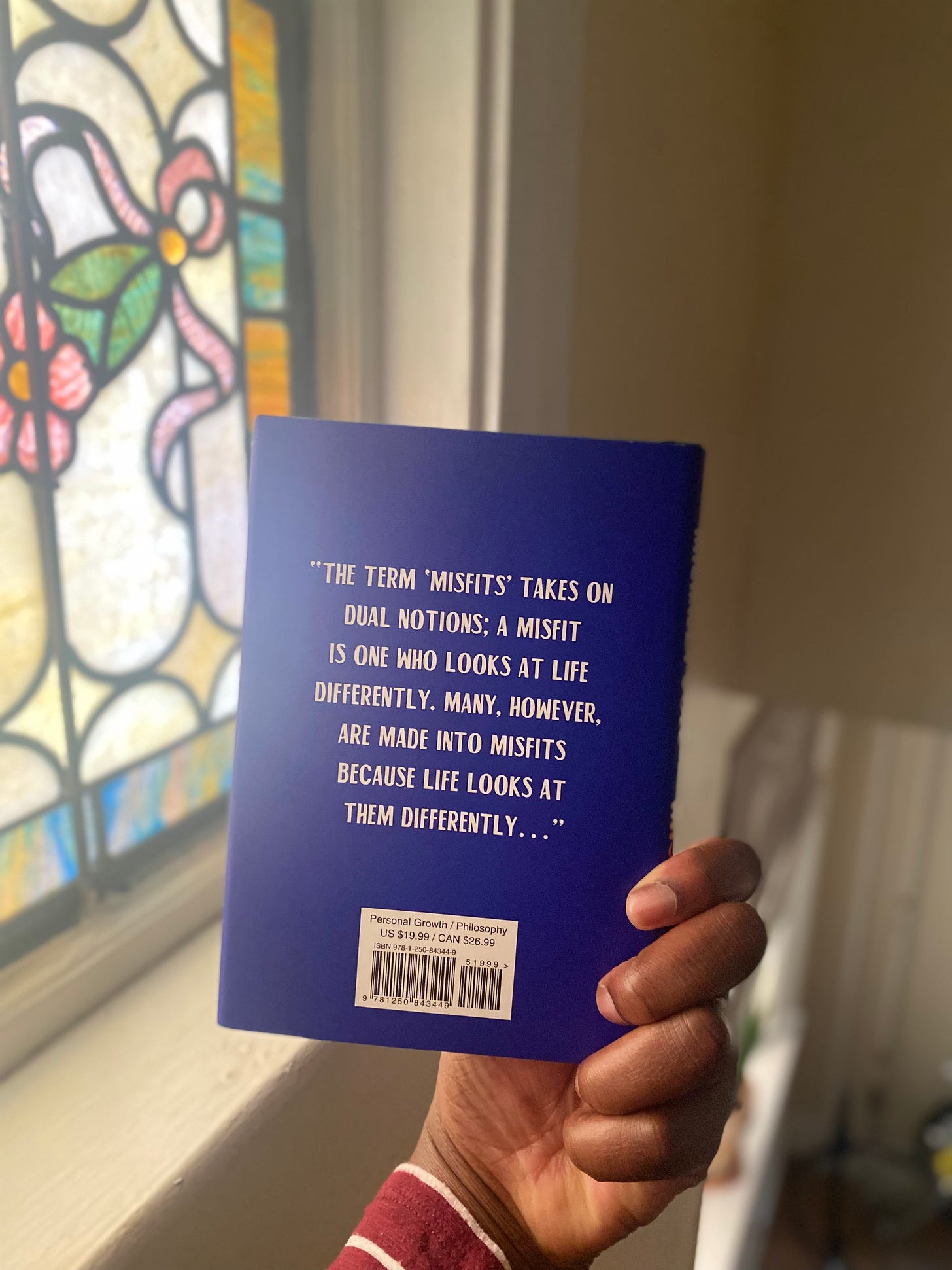 the back of Michaela Coel's "Misfits," with a quote from the caption. 