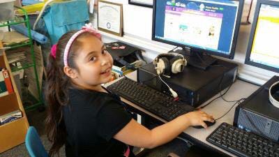 A young child using a computer

Description automatically generated