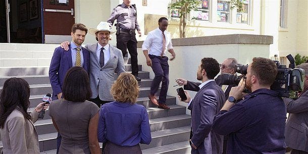 WAlker gay Liam with Stan on steps to press talk.