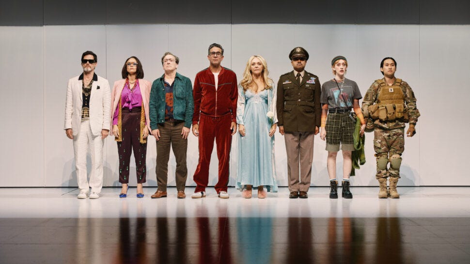 The full cast of Here We Are at The Shed lined up in a row on a white stage.
