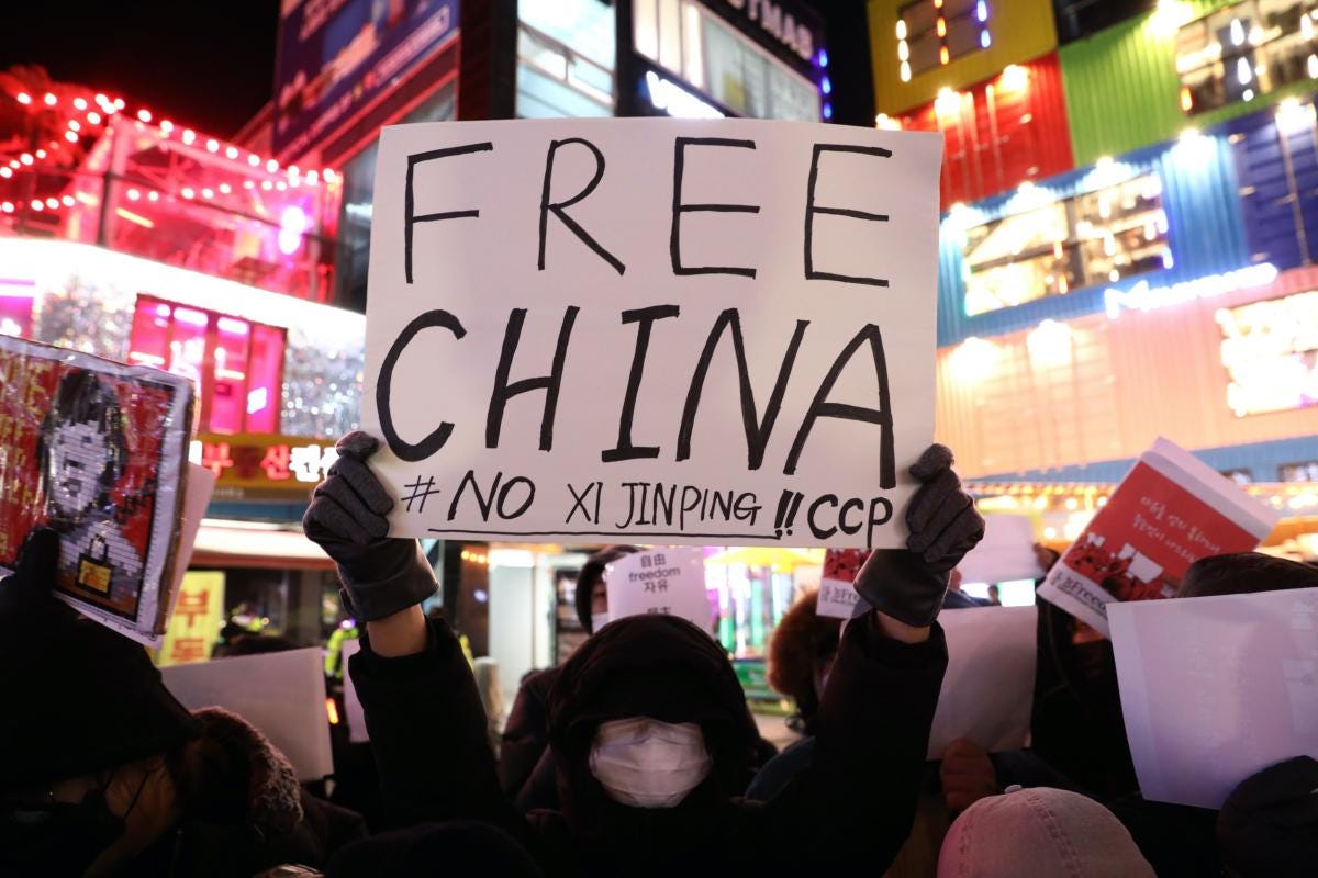  Protesters participate in a vigil commemorating victims of the Chinese regime's zero-COVID policy in Seoul, South Korea, on Nov. 30, 2022. Protesters took to the streets in multiple Chinese cities after a deadly apartment fire in Xinjiang sparked a national outcry as many blamed COVID-19 restrictions for the deaths. The protests have become a lightning rod for discontent within China and represent the most visible challenge to the Chinese Communist Party since 1989. (Chung Sung-Jun/Getty Images)